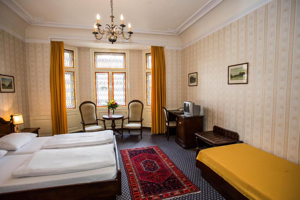 Postel nebo postele na pokoji v ubytování Hotel Atlanta