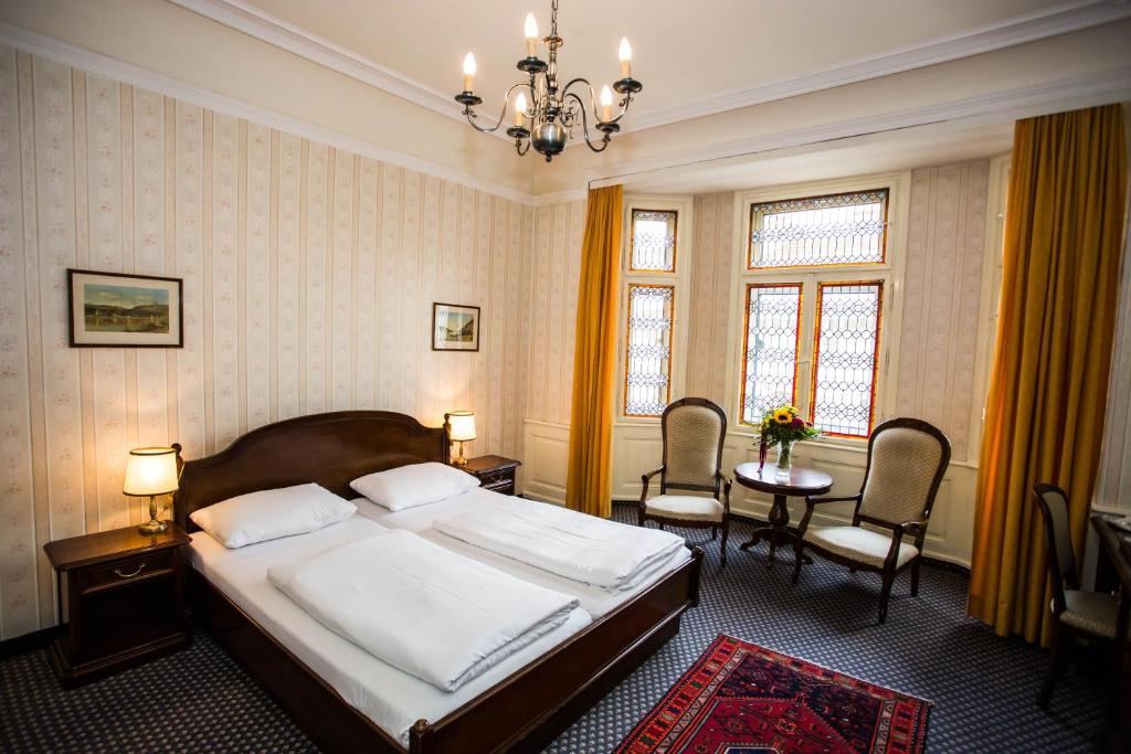 Postel nebo postele na pokoji v ubytování Hotel Atlanta