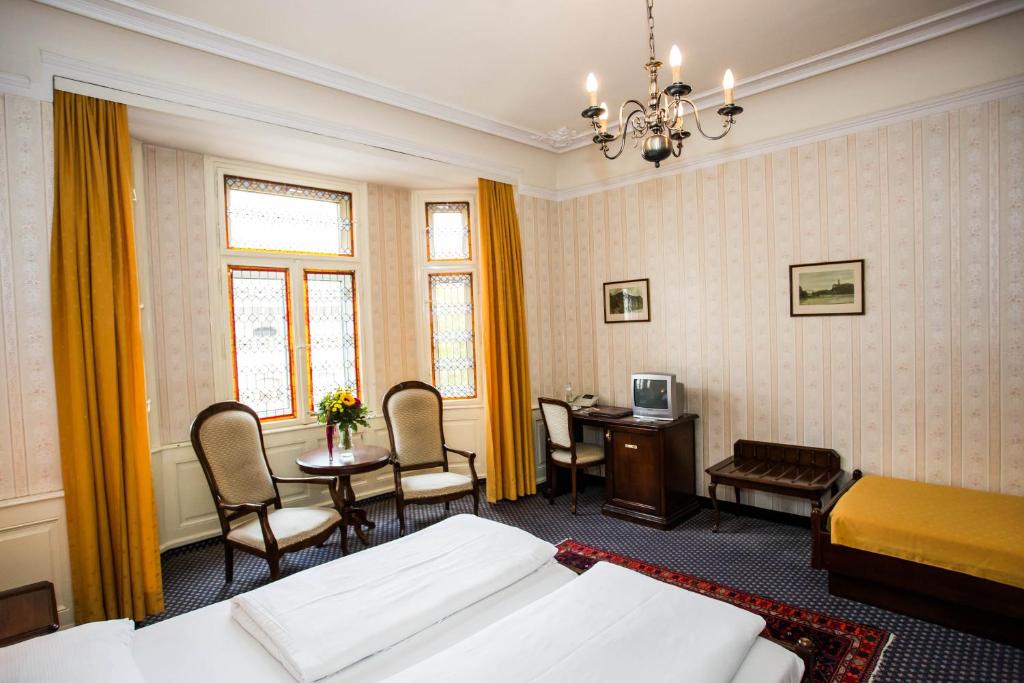 Postel nebo postele na pokoji v ubytování Hotel Atlanta