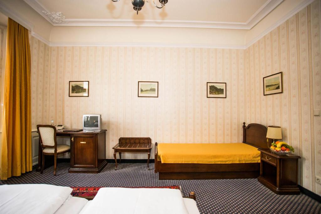 Postel nebo postele na pokoji v ubytování Hotel Atlanta