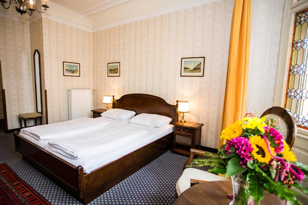 Postel nebo postele na pokoji v ubytování Hotel Atlanta