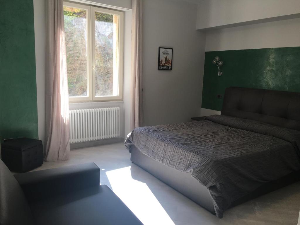 Postel nebo postele na pokoji v ubytování Le Divine di via Olivieri - Reception Via XXV Aprile 5