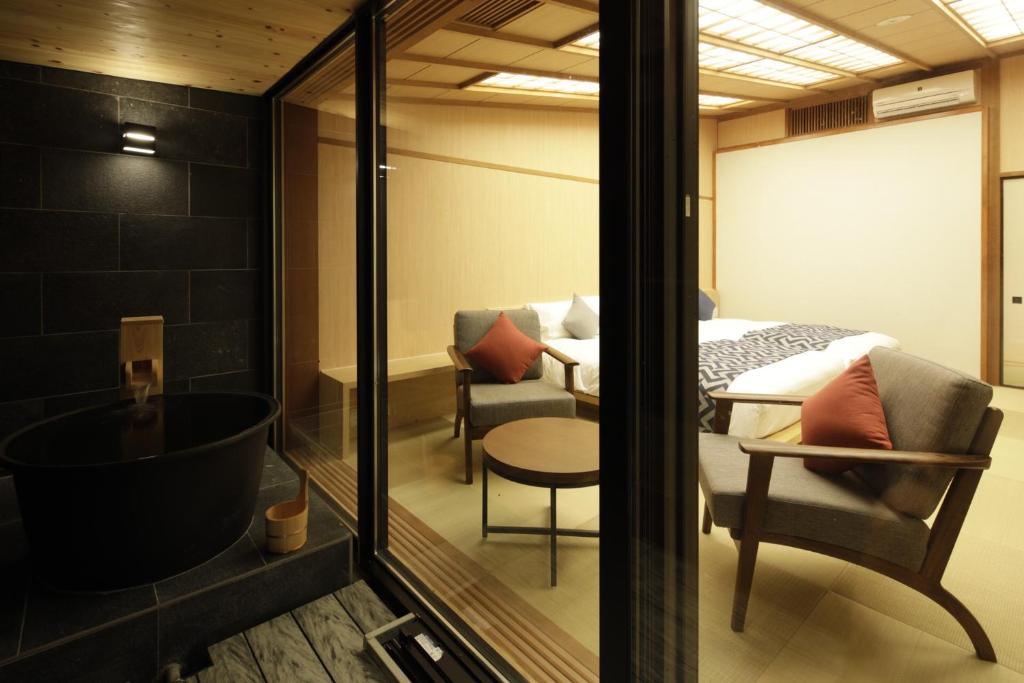 Postel nebo postele na pokoji v ubytování Centurion Hakone Bettei