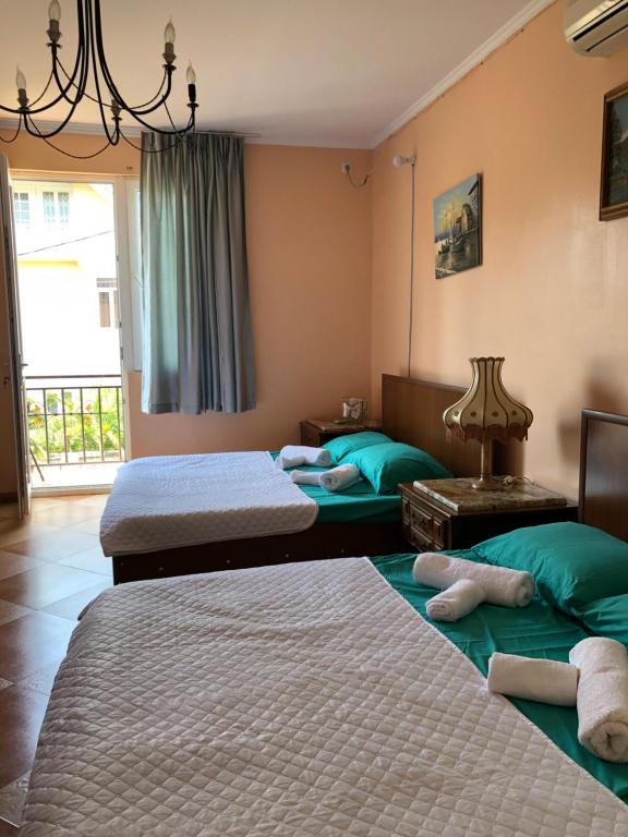 Postel nebo postele na pokoji v ubytování Villa Gardenia Ureki