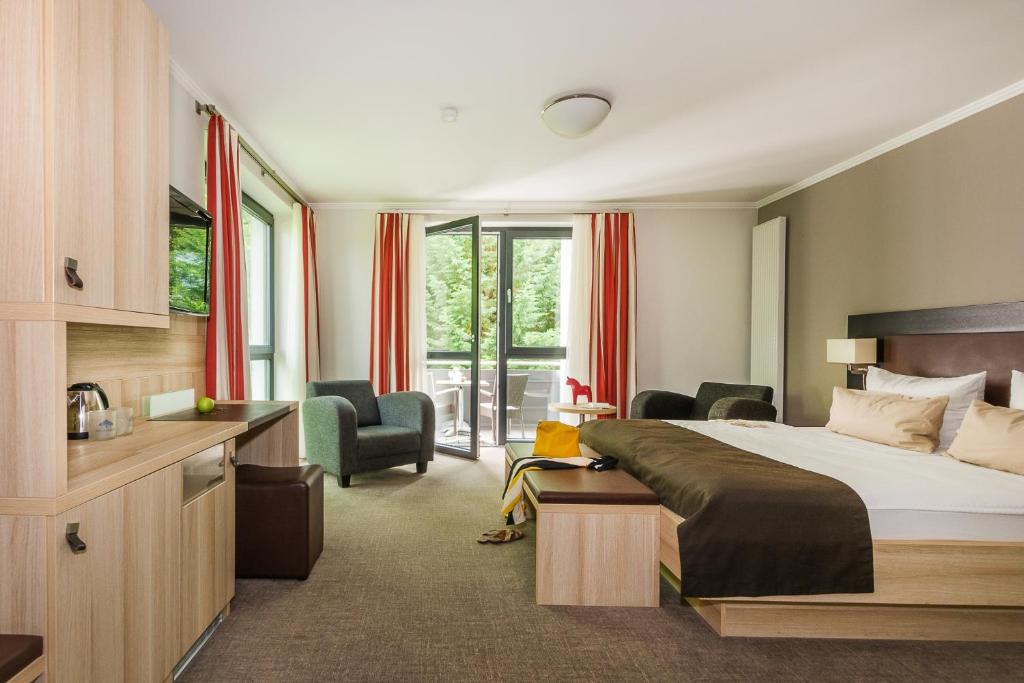 Postel nebo postele na pokoji v ubytování Romantik Hotel Ahrenberg