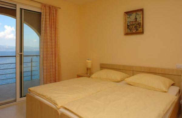 Posteľ alebo postele v izbe v ubytovaní Apartments Villa Amalia