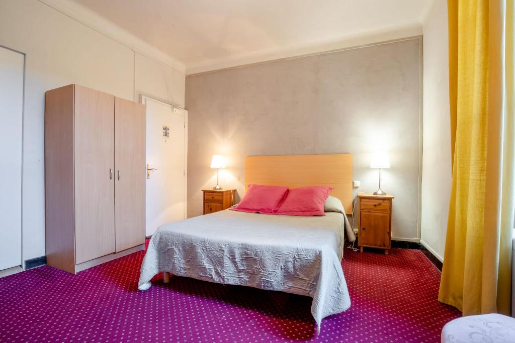 Postel nebo postele na pokoji v ubytování Hôtel Le Foch