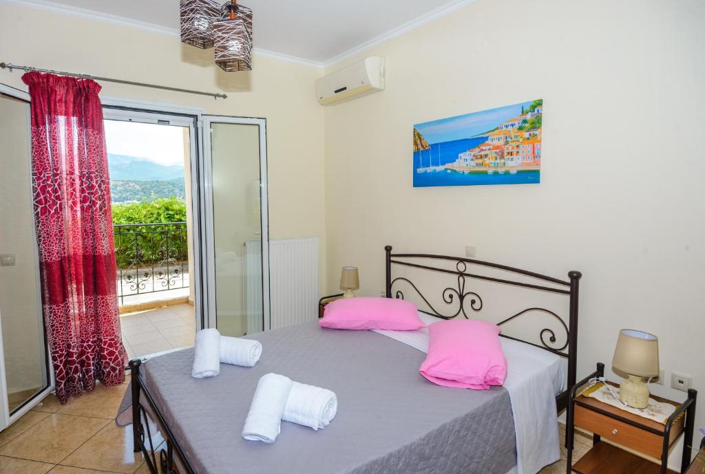 A bed or beds in a room at Thano's Residence
