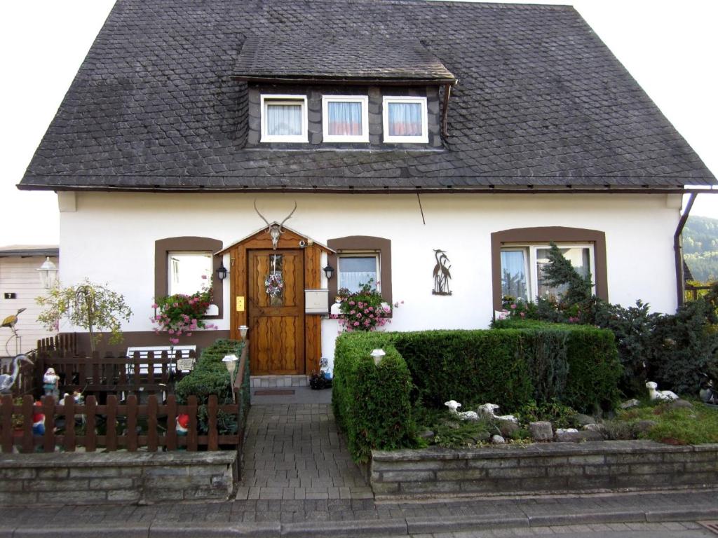 a white house with a brown roof at Ferienwohnungen Kießler in Winterberg