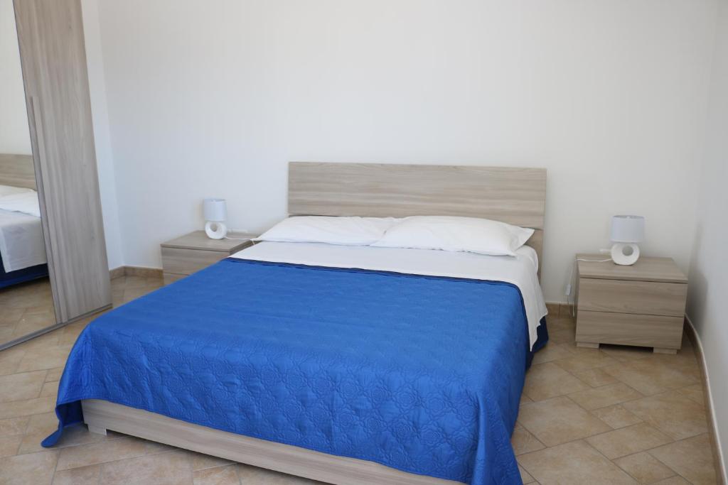 A bed or beds in a room at Atmosphera Casarano