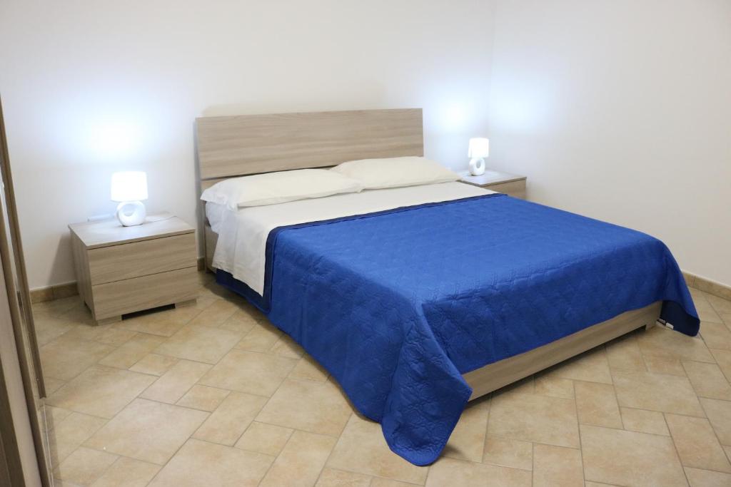 A bed or beds in a room at Atmosphera Casarano