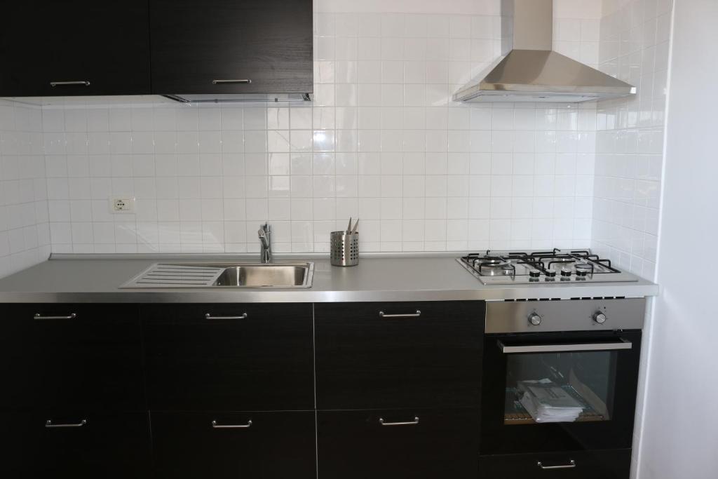 A kitchen or kitchenette at Atmosphera Casarano