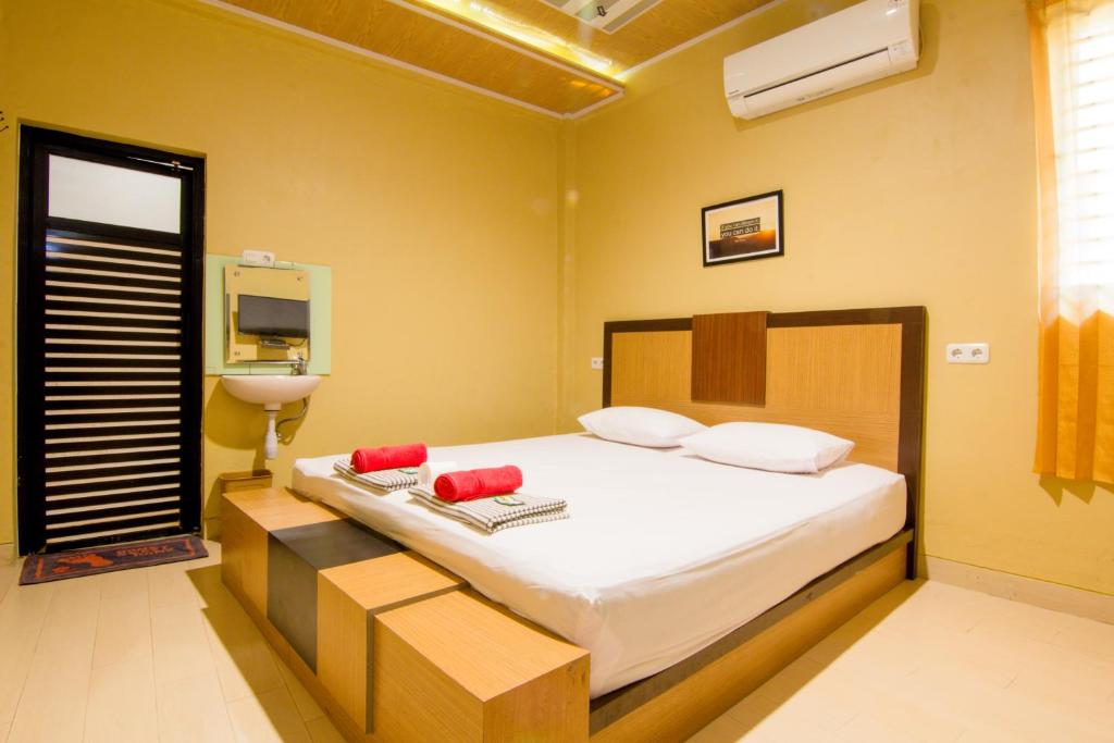 Säng eller sängar i ett rum på Yani Homestay