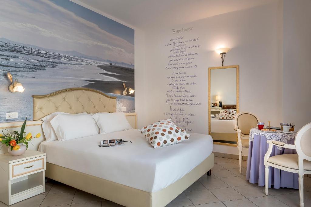 Postel nebo postele na pokoji v ubytování Sovrana Hotel & SPA