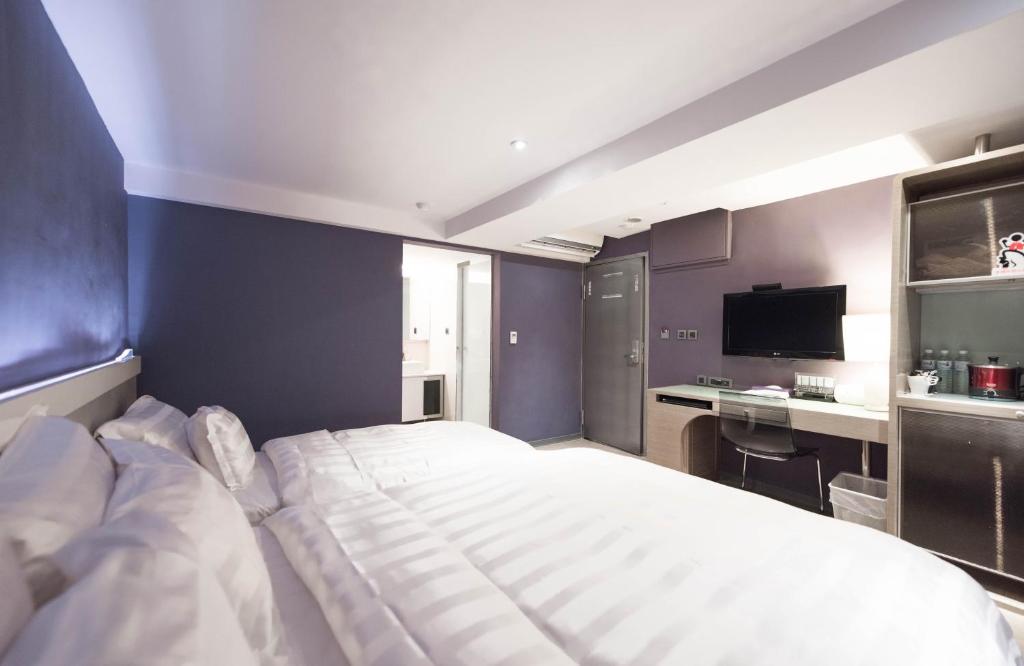 Postel nebo postele na pokoji v ubytování Saual Keh Hotel