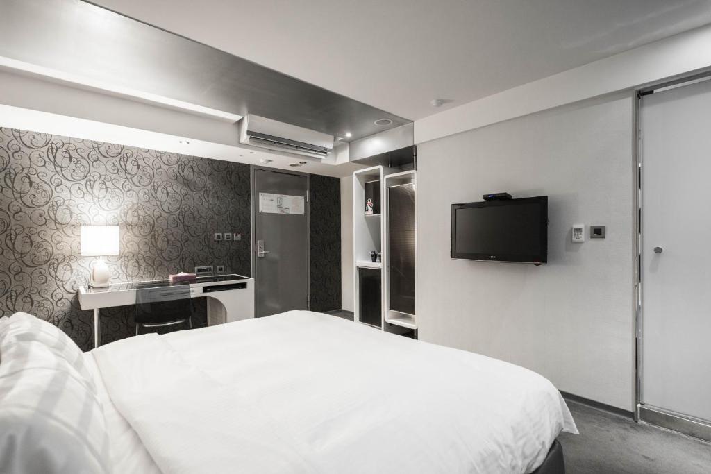 TV a/nebo společenská místnost v ubytování Saual Keh Hotel