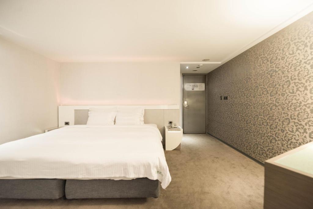 Postel nebo postele na pokoji v ubytování Saual Keh Hotel
