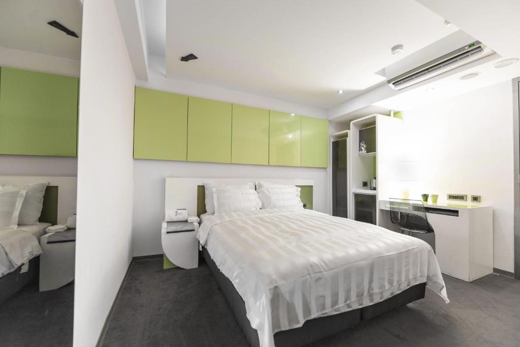 Postel nebo postele na pokoji v ubytování Saual Keh Hotel