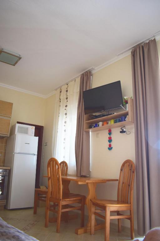 TV a/nebo společenská místnost v ubytování Tündérfátyol vendégház
