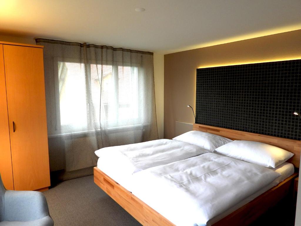 Postel nebo postele na pokoji v ubytování Hotel Ländli