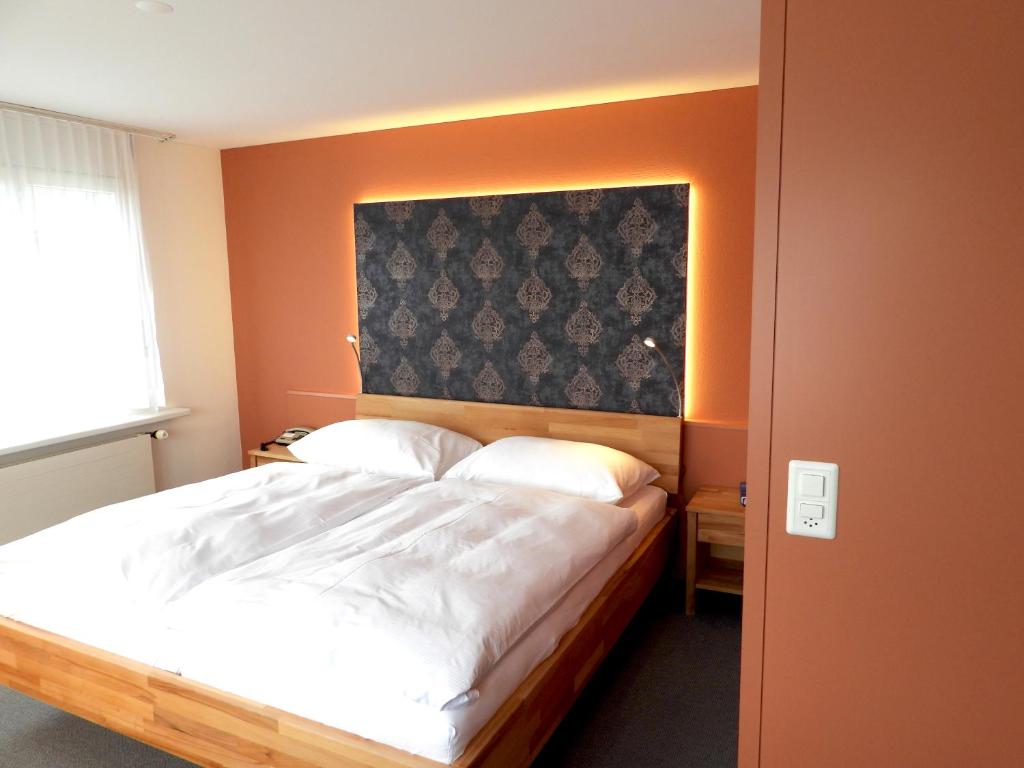 Postel nebo postele na pokoji v ubytování Hotel Ländli