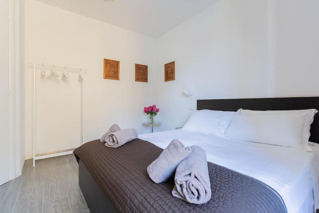 Postel nebo postele na pokoji v ubytování Romantic Pier by Rent All Como