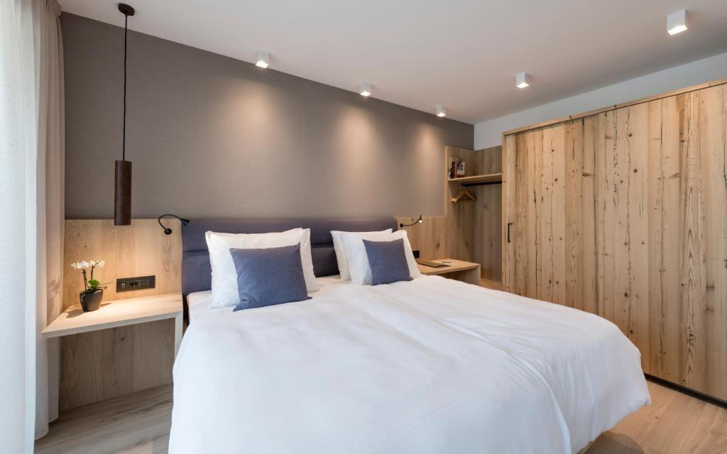 Postel nebo postele na pokoji v ubytování Vinea - Suites