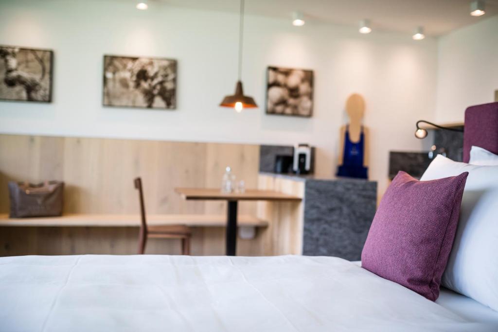 Postel nebo postele na pokoji v ubytování Vinea - Suites