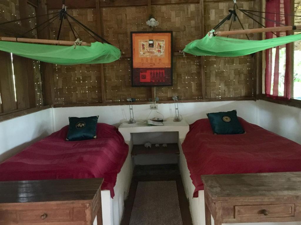 Ein Bett oder Betten in einem Zimmer der Unterkunft Sang Tong Huts