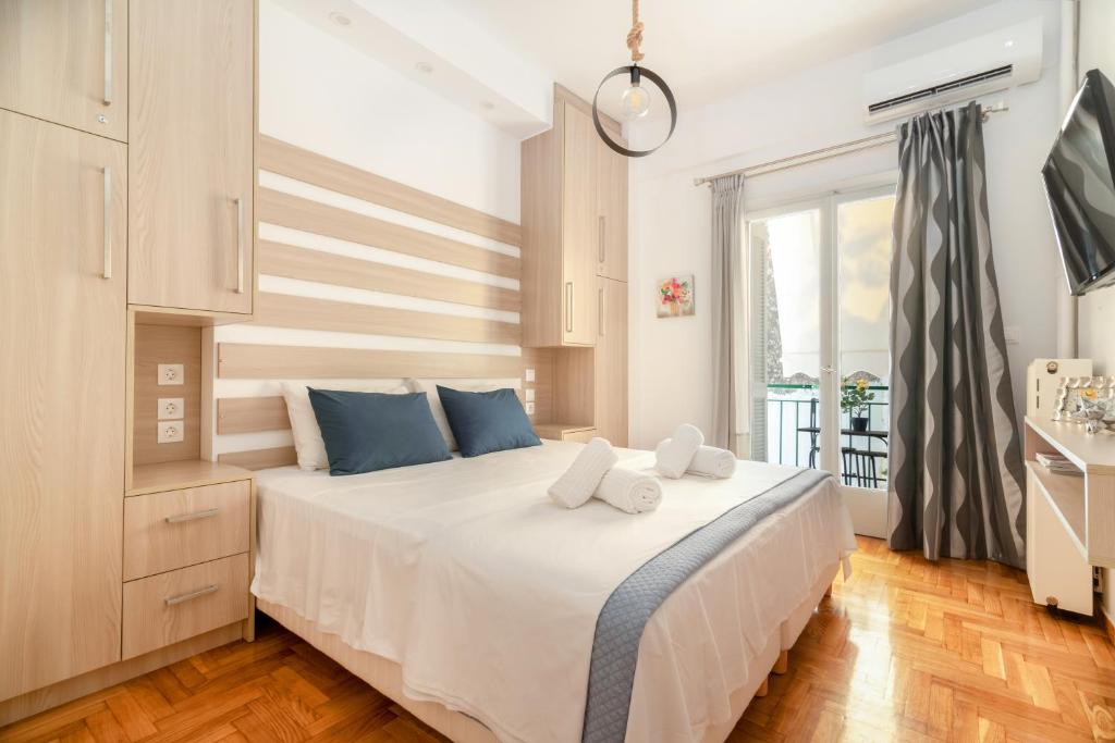 Postel nebo postele na pokoji v ubytování Hermes by Heloni Apartments