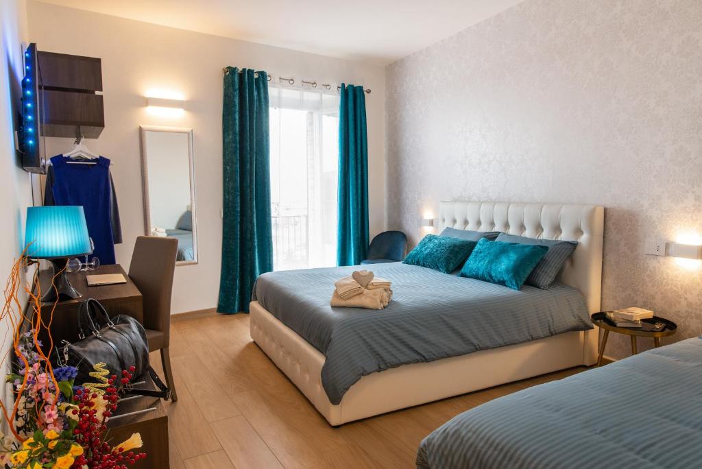 Postel nebo postele na pokoji v ubytování Assisi Panoramic Rooms