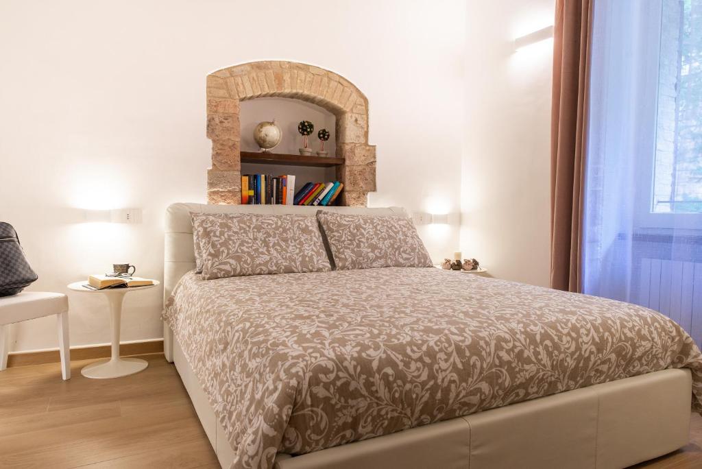 Postel nebo postele na pokoji v ubytování Assisi Panoramic Rooms