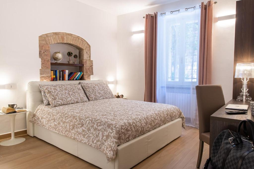 Postel nebo postele na pokoji v ubytování Assisi Panoramic Rooms