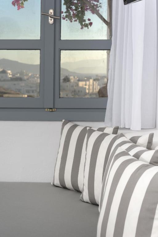 Postel nebo postele na pokoji v ubytování Iliada Suites
