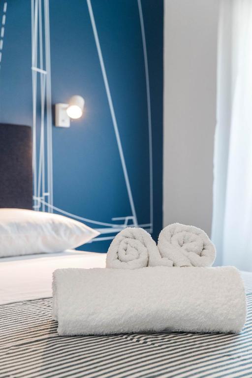Posteľ alebo postele v izbe v ubytovaní APARTMANI VIGO