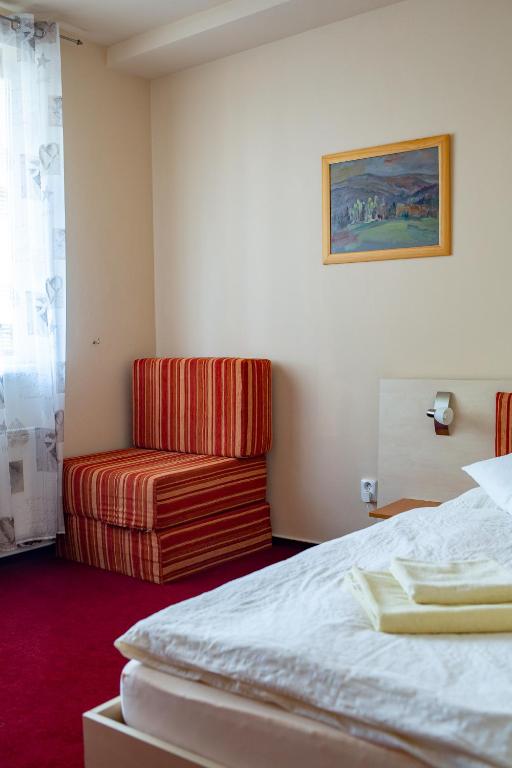 Postel nebo postele na pokoji v ubytování Penzion Na Kurtech