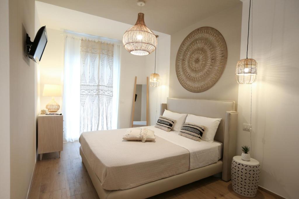 A bed or beds in a room at Amor di Casa