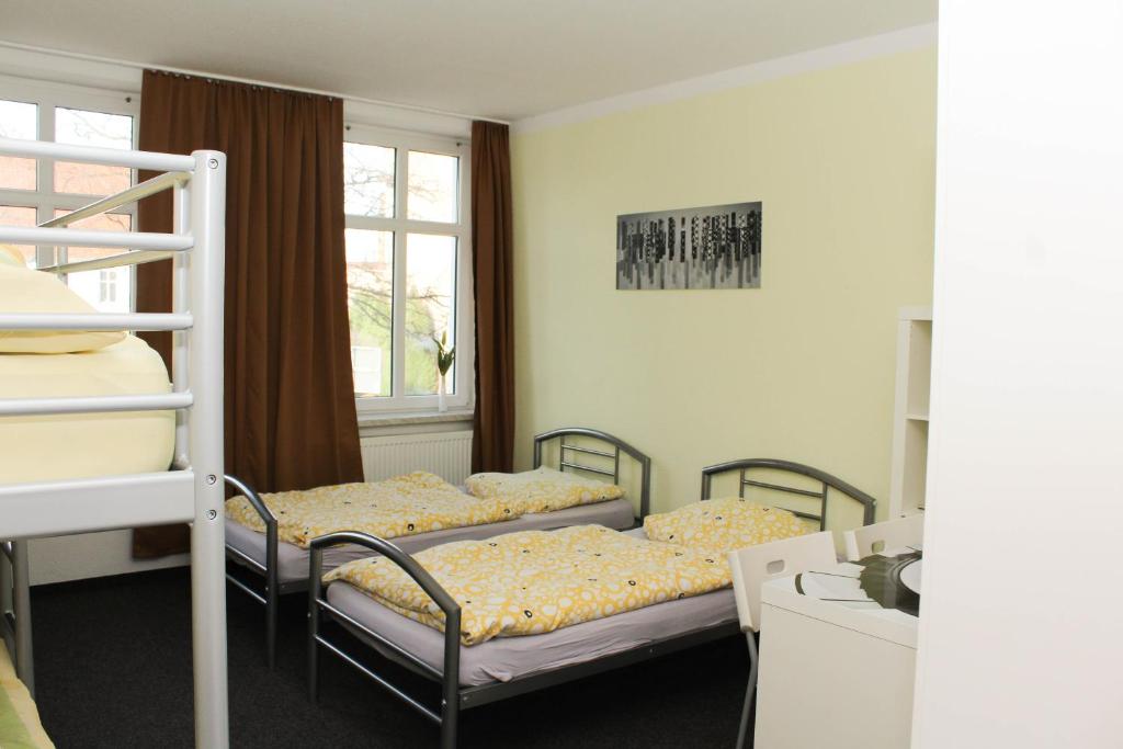 Ένα ή περισσότερα κρεβάτια σε δωμάτιο στο Pension BERLIn in Spremberg (4)