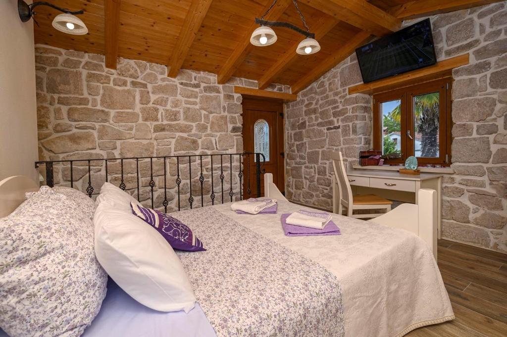 Postel nebo postele na pokoji v ubytování Villa Dajana