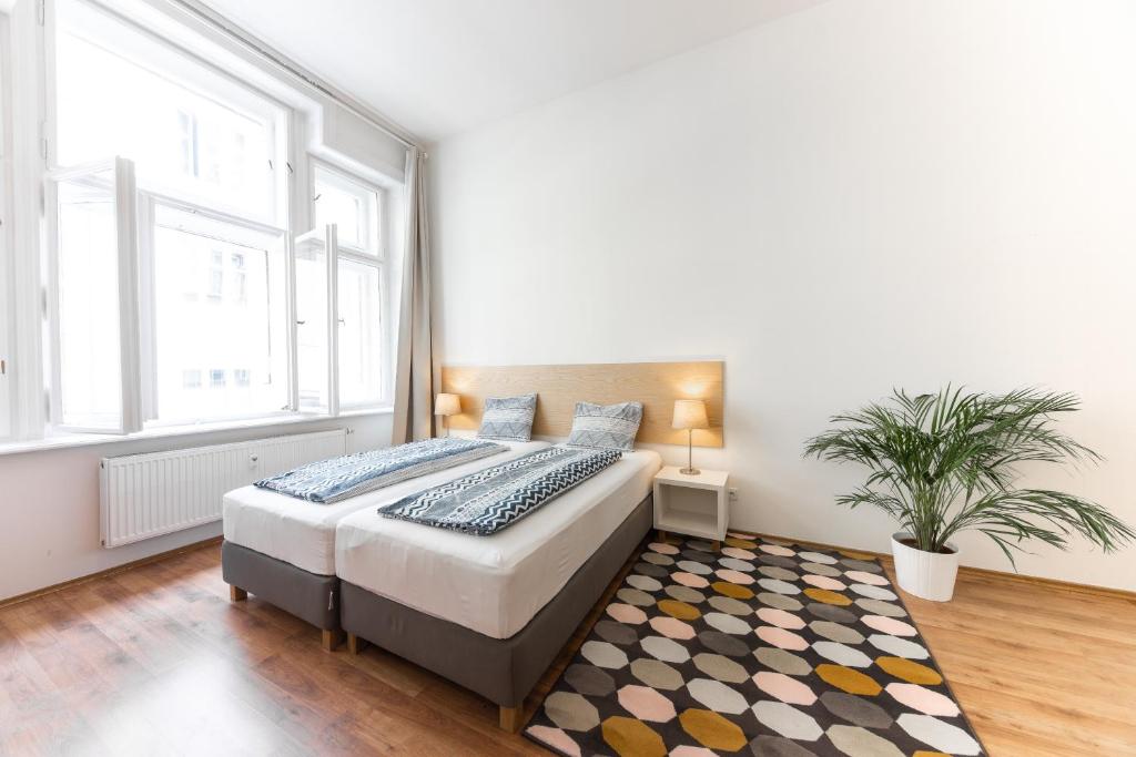 Posteľ alebo postele v izbe v ubytovaní Jacob Brno Apartments