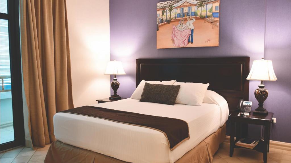 Una cama o camas en una habitación de Hotel Presidente Las Tablas