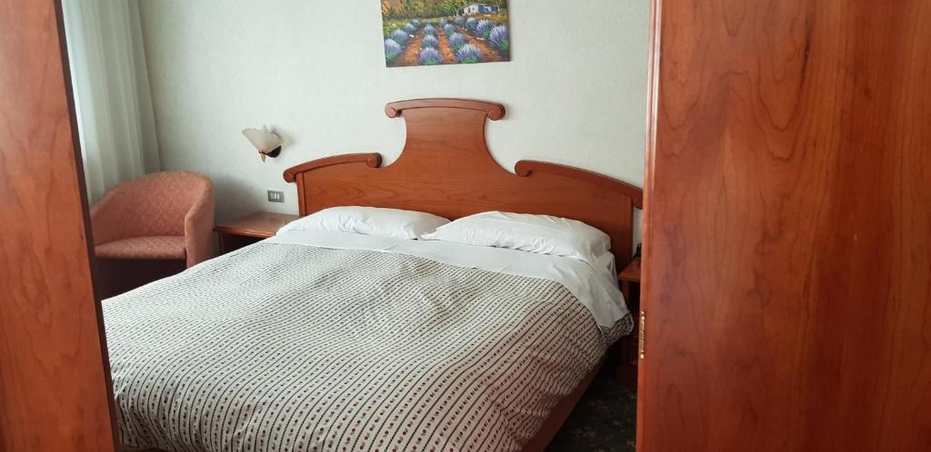 Postel nebo postele na pokoji v ubytování Hotel Moena