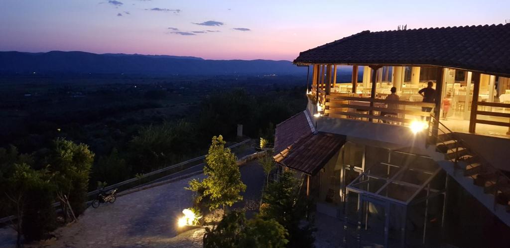 an aerial view of a building with the sunset in the background at Hylli i drites in Lezhë