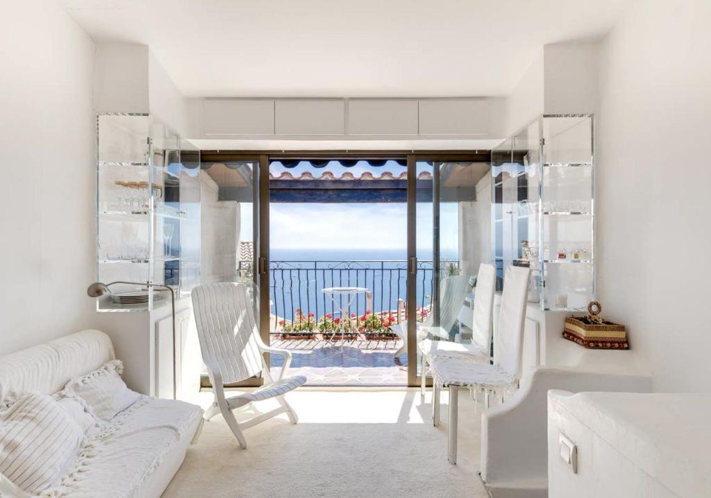 a living room with a view of the ocean at Ciel d´Azur in Roquebrune-Cap-Martin