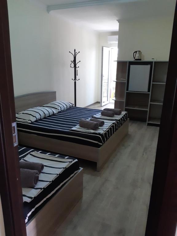 Postel nebo postele na pokoji v ubytování Ureki GuestHouse
