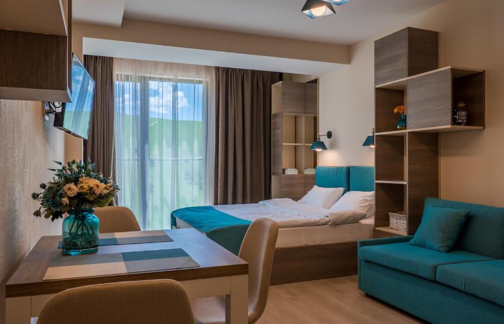 Postel nebo postele na pokoji v ubytování SkyTop Studios