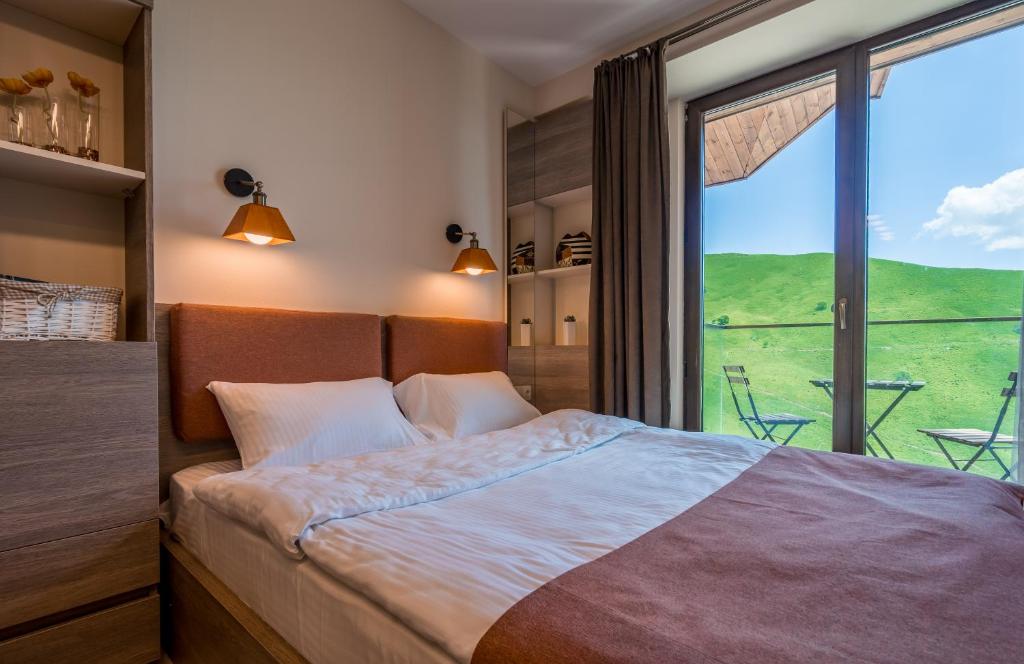 Postel nebo postele na pokoji v ubytování SkyTop Studios