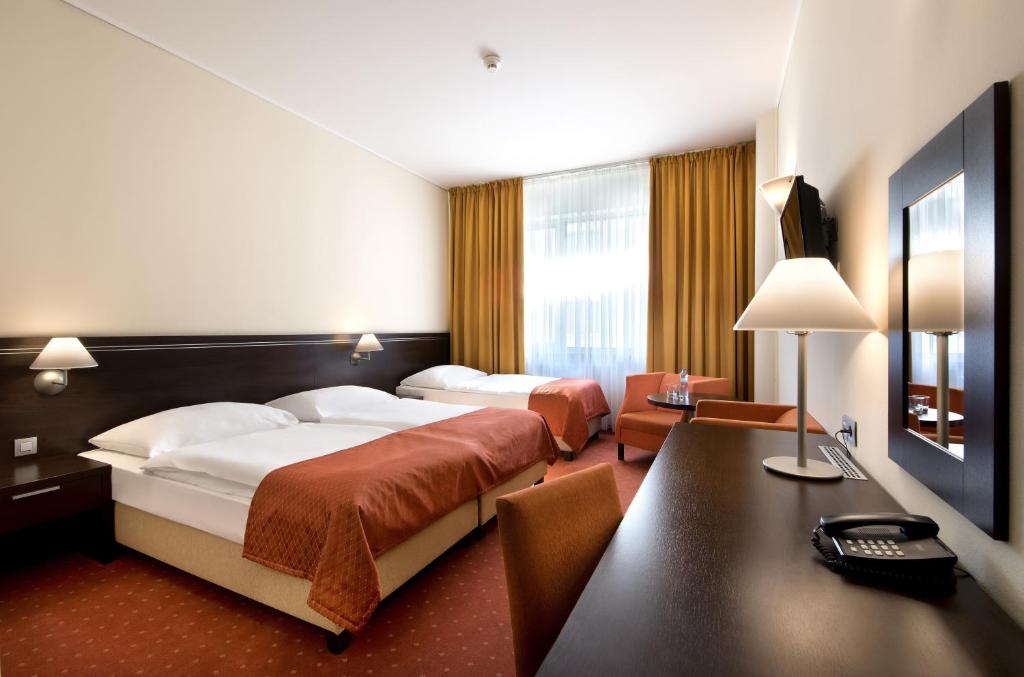 Postel nebo postele na pokoji v ubytování Hotel Tatra