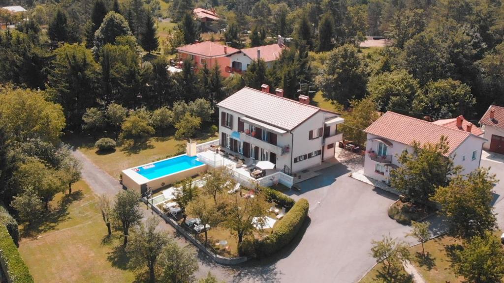 an aerial view of a house with a swimming pool at Guest House Surina in Rupa