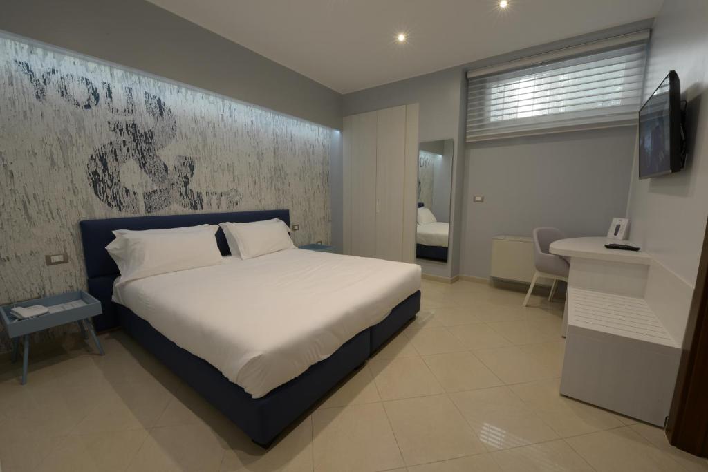Postel nebo postele na pokoji v ubytování Imperiali Hotel